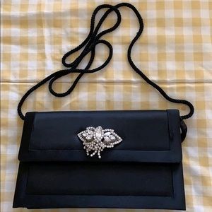 Evening satin black bag with diamonds broach